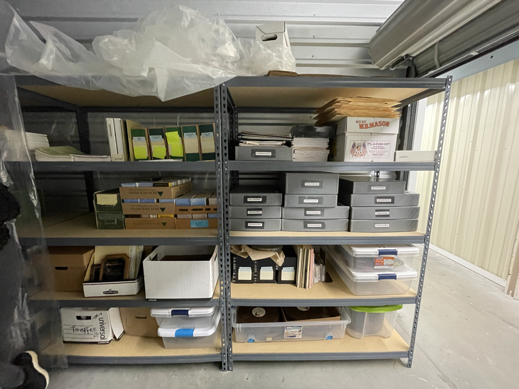 Collections Assessment for Preservation at the Disaster Research Center Metal shelving units in the Annex storing several organizer boxes in acid-free cardboard and plastic.