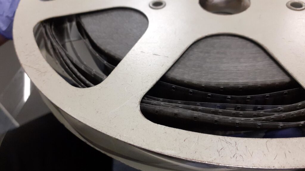 Collections Assessment for Preservation at the Disaster Research Center Zoom of an unravelling film reel.