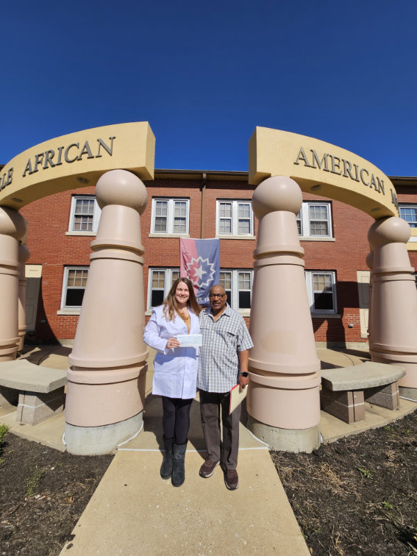 Tory Schendel-Vyvoda and ?? standing in front of the Evansville African American Museum.