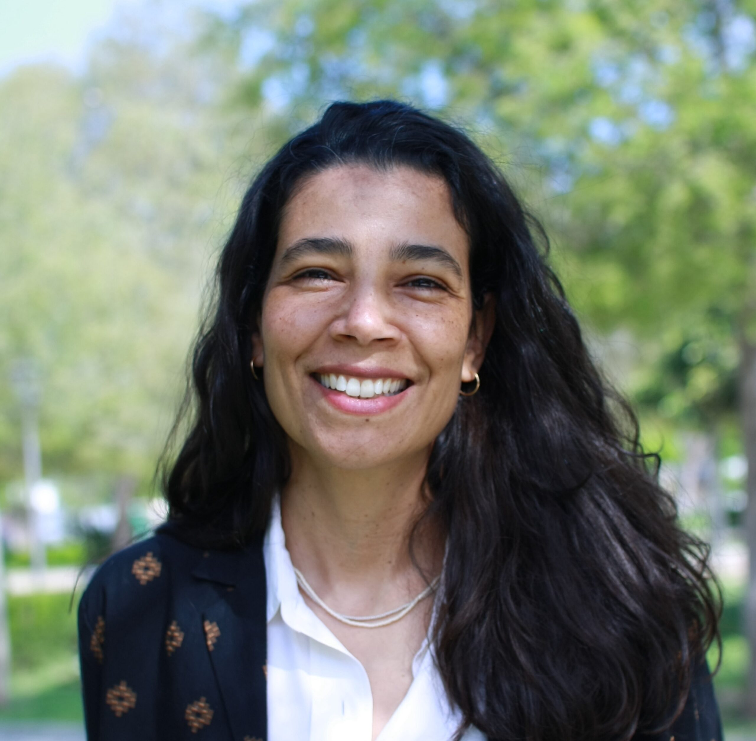Dr. Morena Ferreira, conservation scientist and author of the Conserv Mold Guide, smiling outdoors