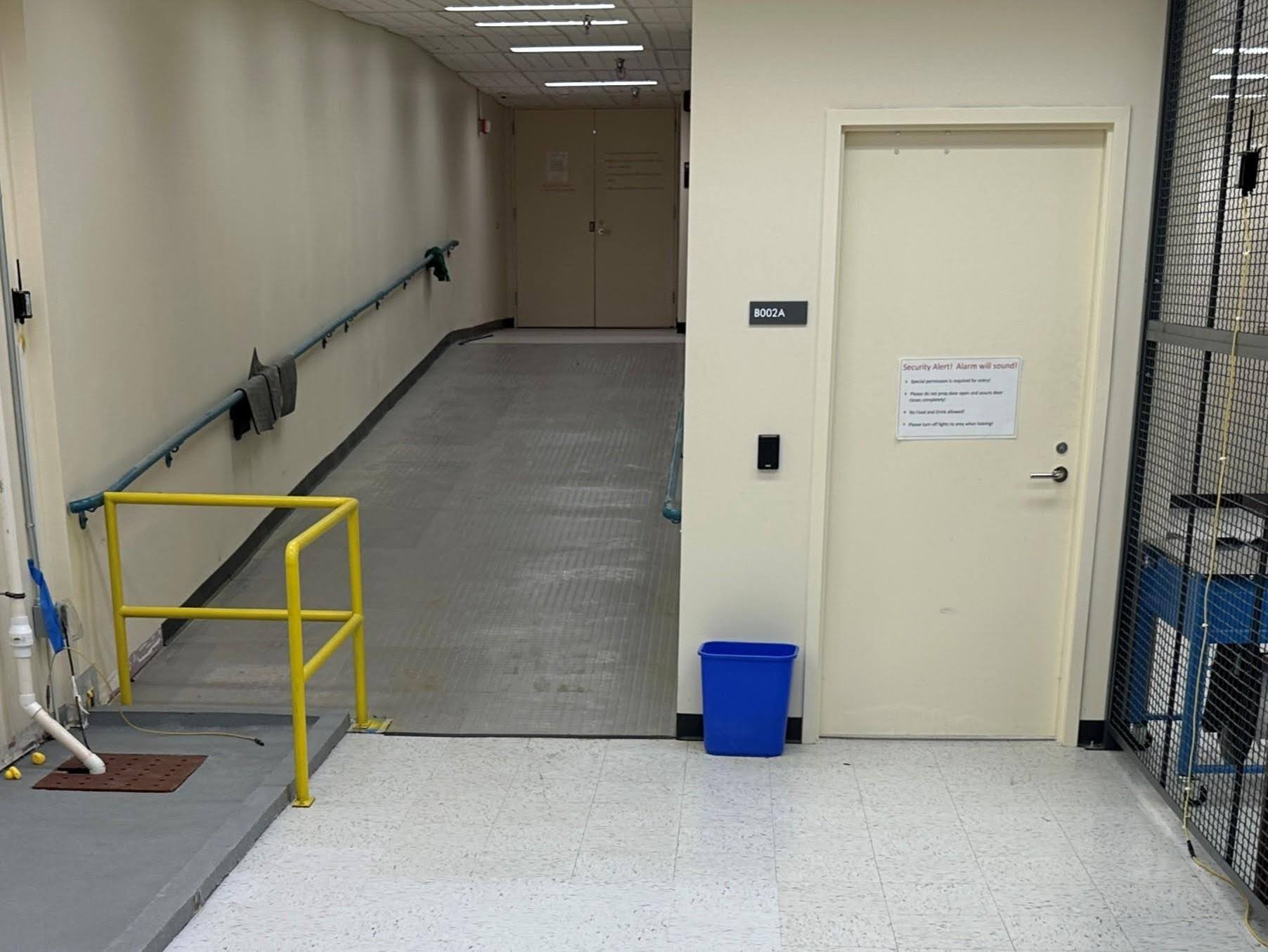 The retention pond built in the ECU Special Collections storage area, with a four-inch barrier containing water from a wall leak